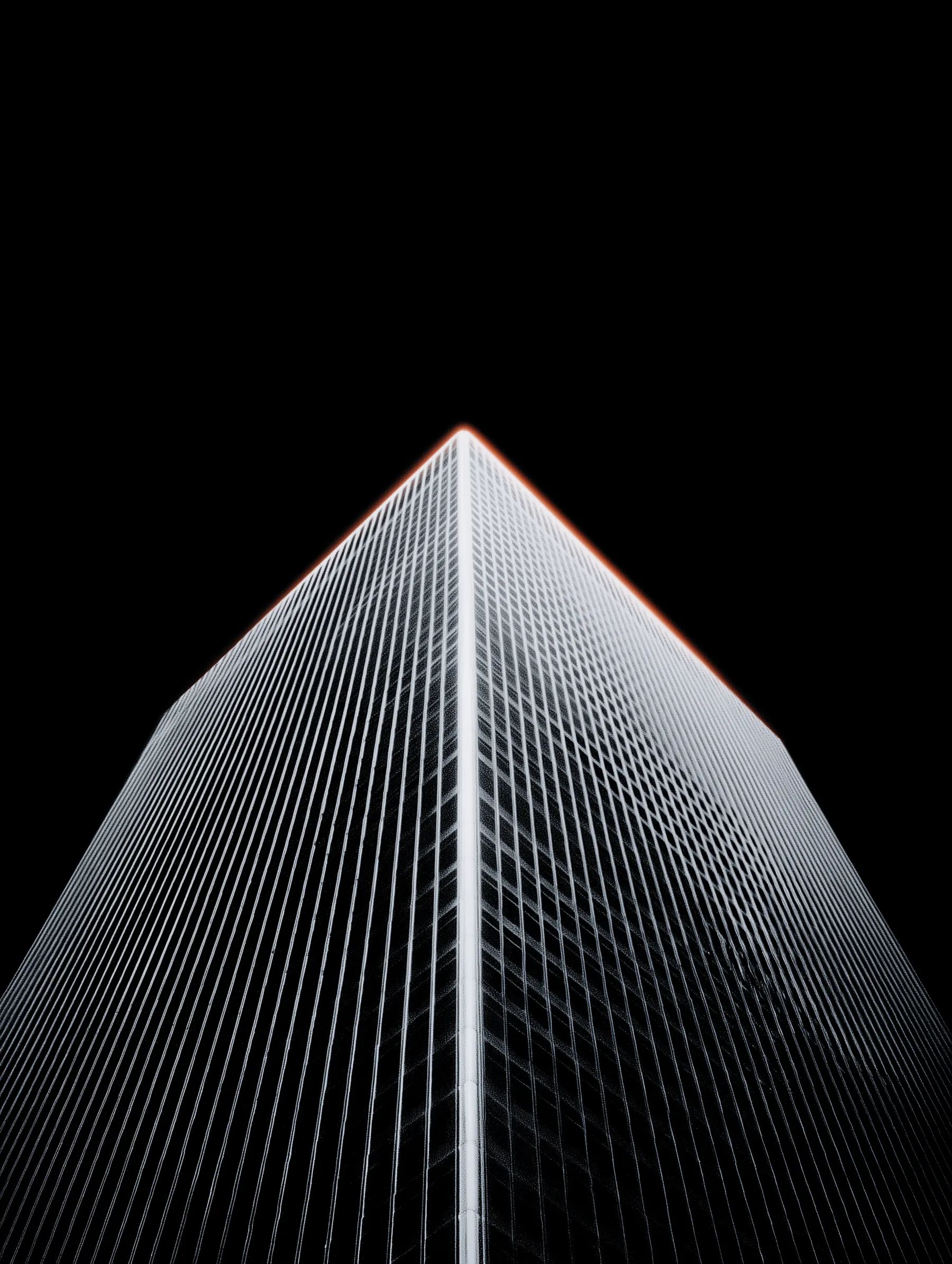Low-angle modern tower on a black background representing the institutional structure behind ARCO's operating decisions