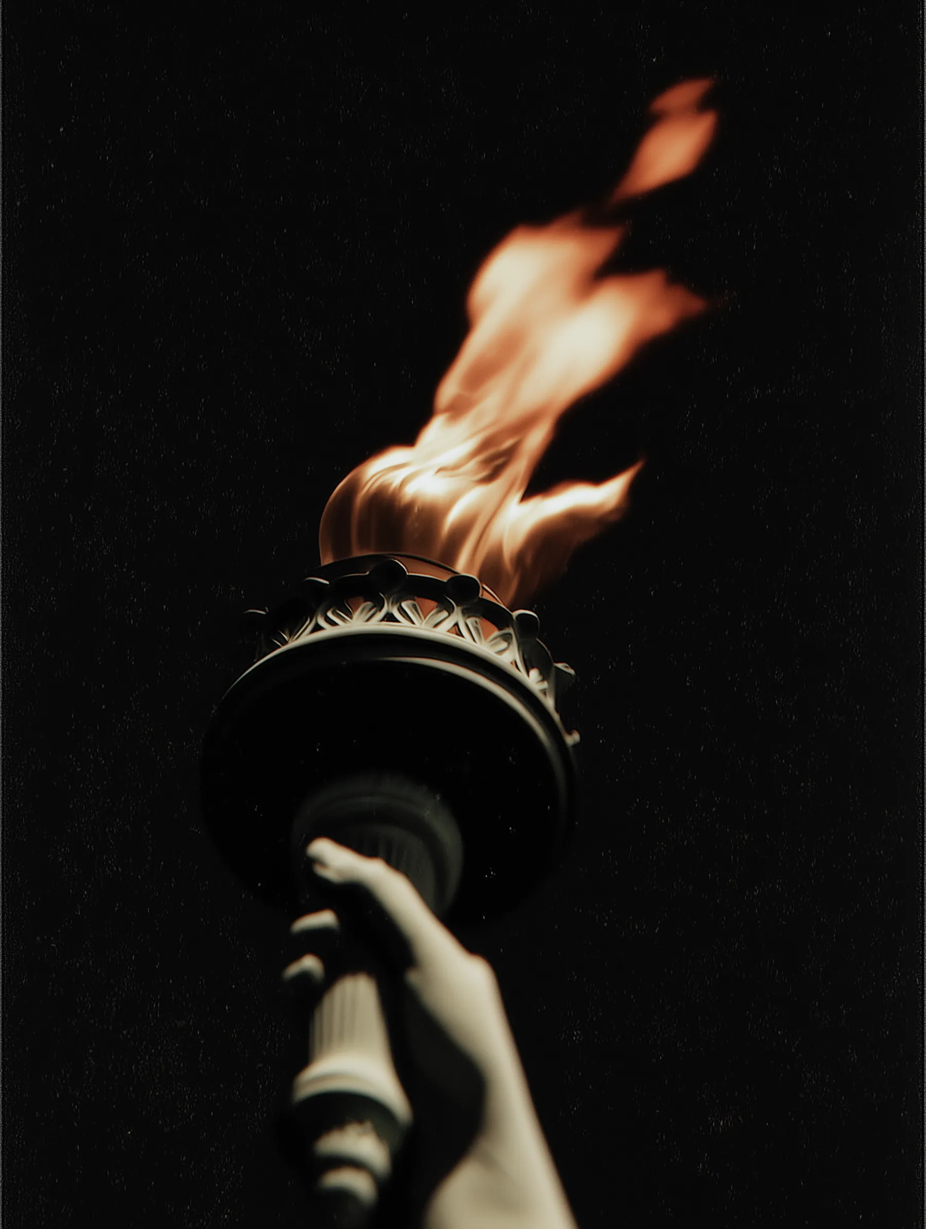 Statue of Liberty torch held high representing ARCO's cross-border opportunity and cultural exchange outcome