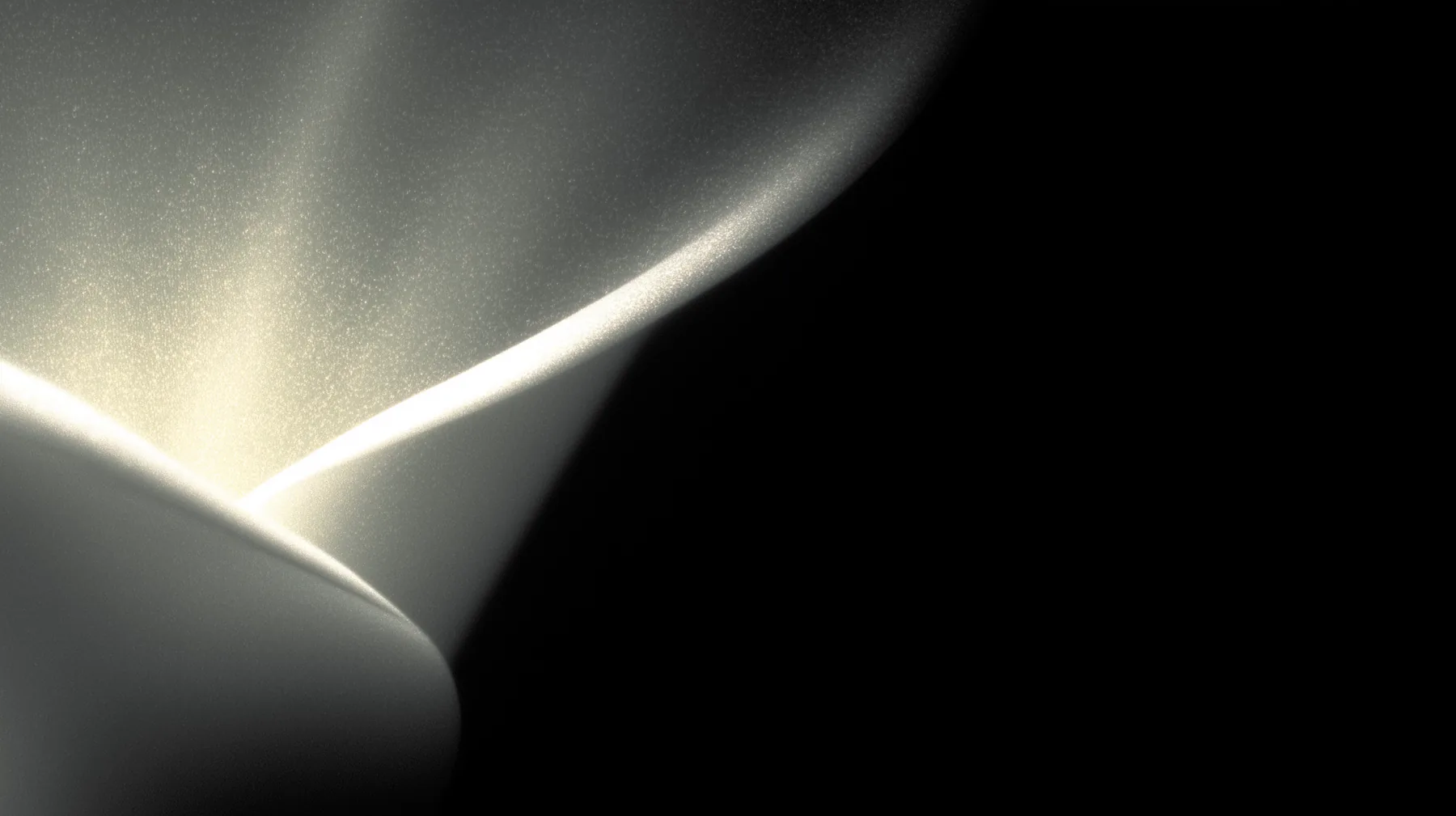 Dark folded surface with a warm light edge representing a refined public-facing outcome